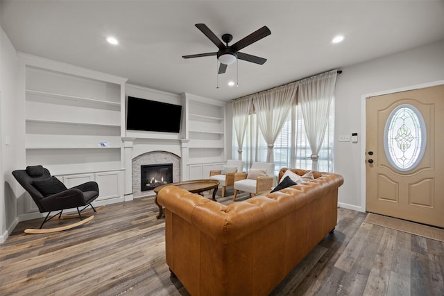 3208 Travis Ave, Fort Worth, TX 76110 - living area with a ceiling fan, a glass covered fireplace, recessed lighting, wood finished floors, and baseboards