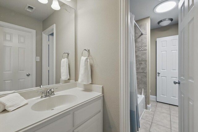 2453 Sir Lovel Ln, Lewisville, TX 75056 - bathroom with tile patterned floors, vanity, and shower / tub combo with curtain