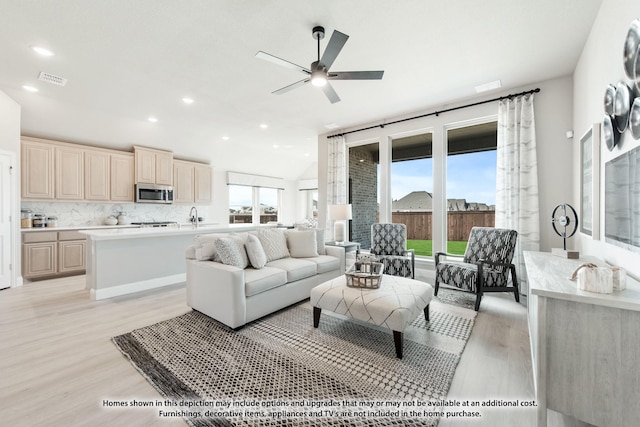 1036 Snowy Owl Dr, Alvarado, TX 76009 - living room featuring light wood-style flooring, ceiling fan, and recessed lighting