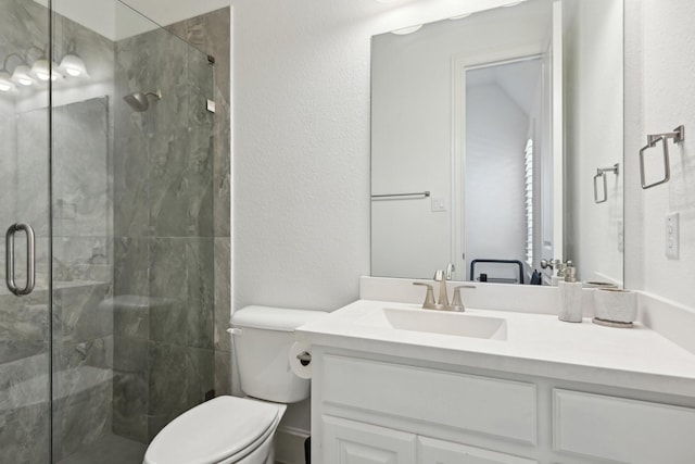 4064 Covent Garden Ln, Frisco, TX 75034 - bathroom featuring toilet, vanity, a stall shower, and a textured wall
