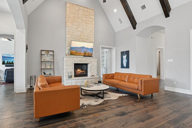 4064 Covent Garden Ln, Frisco, TX 75034 - living room with high vaulted ceiling, arched walkways, a fireplace, baseboards, and wood finished floors