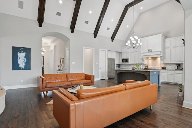 4064 Covent Garden Ln, Frisco, TX 75034 - living area with a chandelier, baseboards, high vaulted ceiling, dark wood-type flooring, and arched walkways