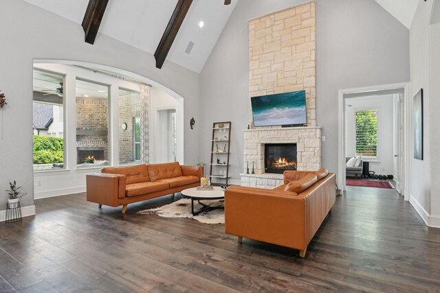 4064 Covent Garden Ln, Frisco, TX 75034 - living room with a stone fireplace, high vaulted ceiling, baseboards, dark wood-type flooring, and ceiling fan
