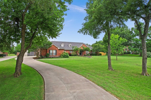 102 Dove Crk, Mckinney, TX 75071 - view of front of property featuring a front lawn, brick siding, and driveway