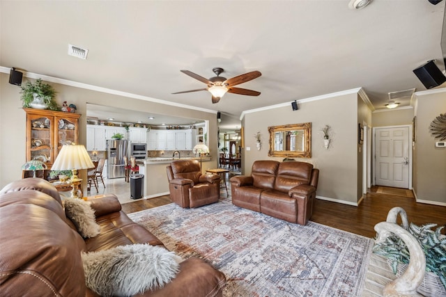 102 Dove Crk, Mckinney, TX 75071 - living room with wood finished floors, a ceiling fan, ornamental molding, and baseboards