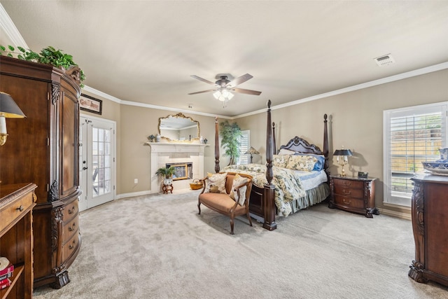 102 Dove Crk, Mckinney, TX 75071 - bedroom featuring light colored carpet, access to exterior, baseboards, ornamental molding, and a fireplace