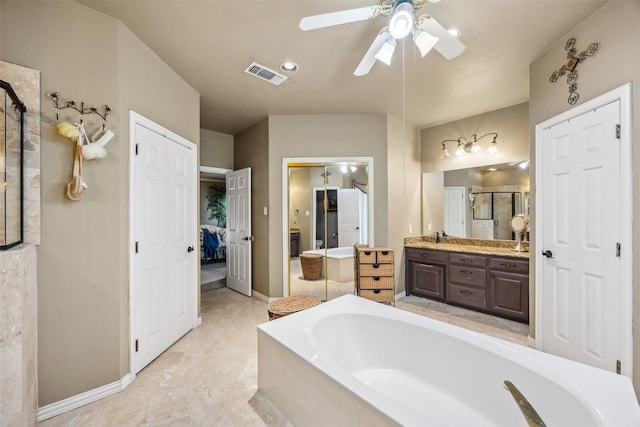 102 Dove Crk, Mckinney, TX 75071 - ensuite bathroom with a garden tub, vanity, a ceiling fan, and baseboards