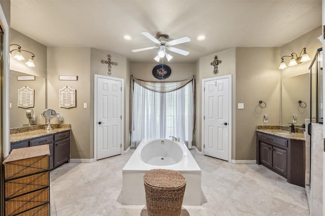 102 Dove Crk, Mckinney, TX 75071 - bathroom featuring a ceiling fan, a garden tub, two vanities, tile patterned floors, and recessed lighting
