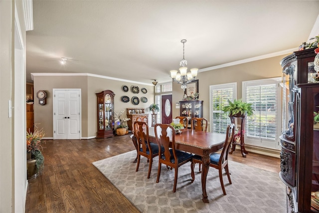 102 Dove Crk, Mckinney, TX 75071 - dining space featuring a chandelier, wood finished floors, crown molding, and baseboards