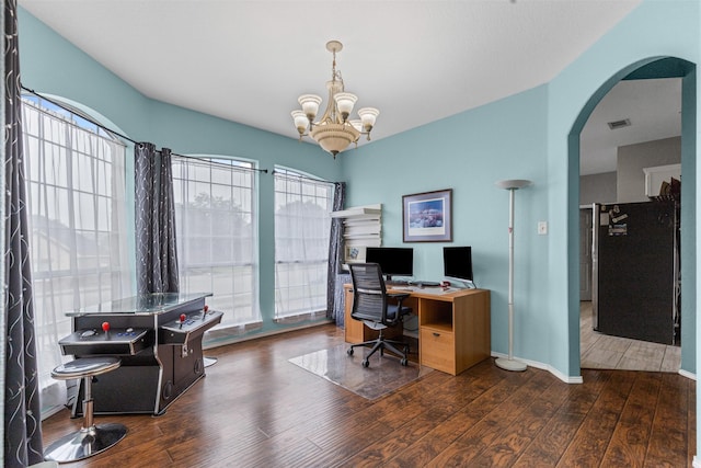 2122 Quail Ridge Dr, Weatherford, TX 76087 - office area featuring arched walkways, wood finished floors, and a chandelier