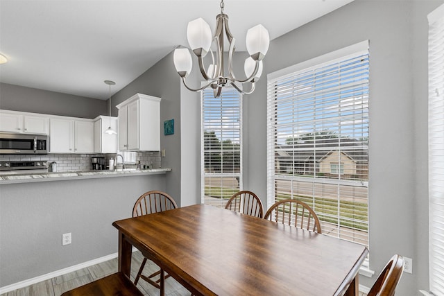 2122 Quail Ridge Dr, Weatherford, TX 76087 - dining room featuring a chandelier and dark wood-style floors