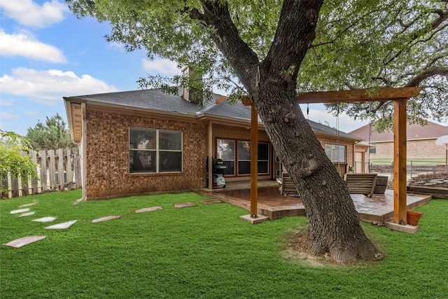 2122 Quail Ridge Dr, Weatherford, TX 76087 - back of house with a shingled roof, a chimney, brick siding, and a deck