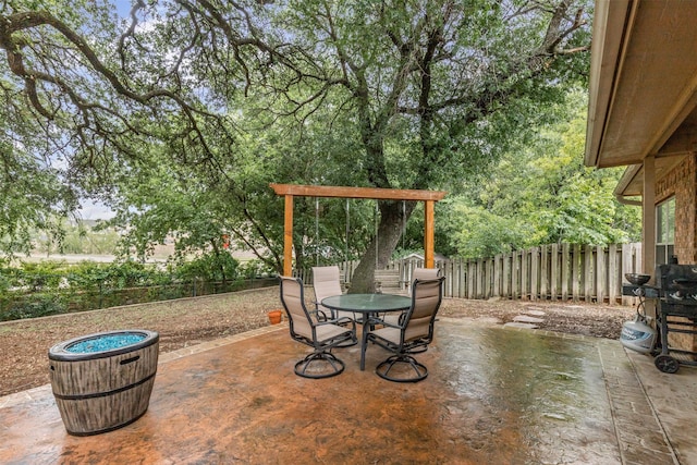 2122 Quail Ridge Dr, Weatherford, TX 76087 - fenced backyard with a patio area and outdoor dining area