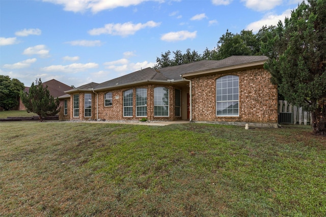 2122 Quail Ridge Dr, Weatherford, TX 76087 - back of property with brick siding and central AC