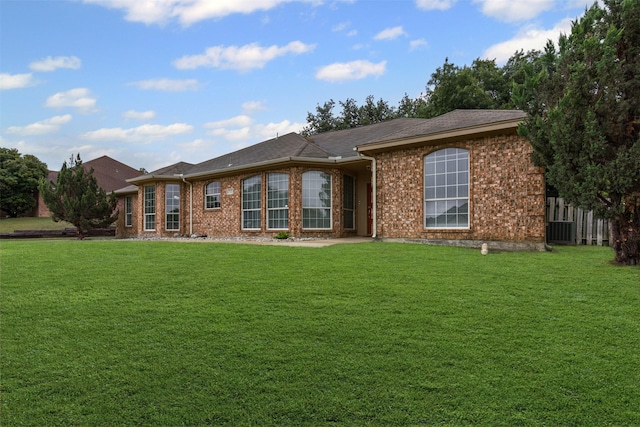 2122 Quail Ridge Dr, Weatherford, TX 76087 - back of house featuring a lawn and brick siding