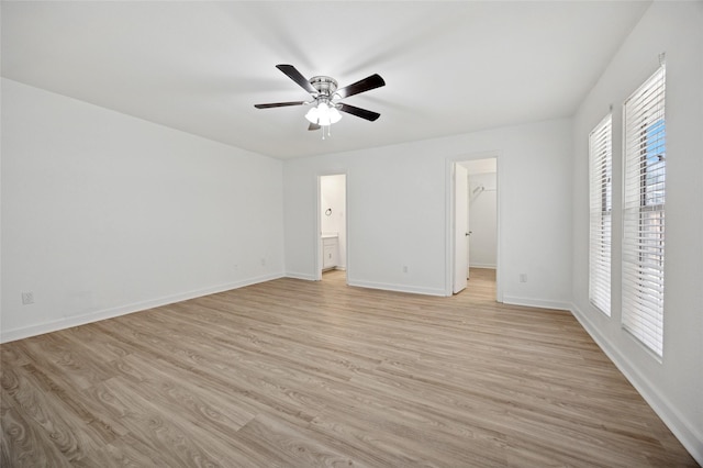 4536 Louisville Dr, Plano, TX 75093 - unfurnished bedroom featuring light wood-type flooring, baseboards, a walk in closet, and connected bathroom