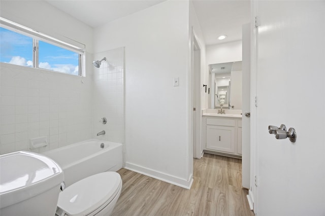 4536 Louisville Dr, Plano, TX 75093 - bathroom with toilet, wood finished floors, vanity,  shower combination, and baseboards