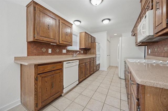 4536 Louisville Dr, Plano, TX 75093 - kitchen featuring white appliances, a sink, backsplash, and light countertops