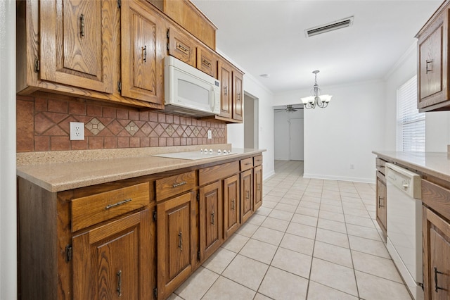 4536 Louisville Dr, Plano, TX 75093 - kitchen with white appliances, backsplash, ornamental molding, a chandelier, and light countertops