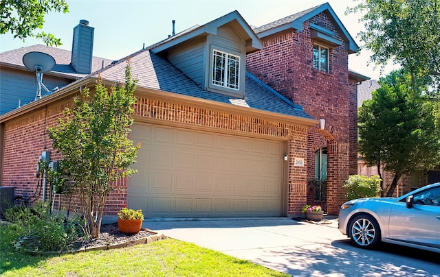 2608 Pine Trail Dr, Little Elm, TX 75068 - view of front facade with brick siding, driveway, a shingled roof, and a garage
