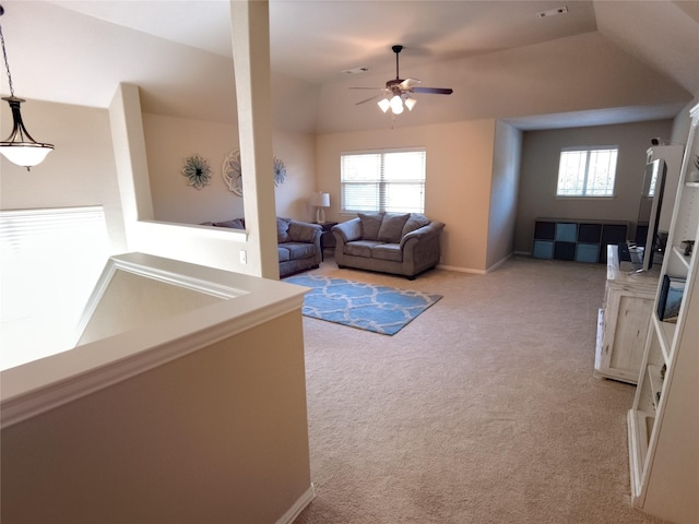 2608 Pine Trail Dr, Little Elm, TX 75068 - living room with a ceiling fan, light carpet, plenty of natural light, vaulted ceiling, and baseboards