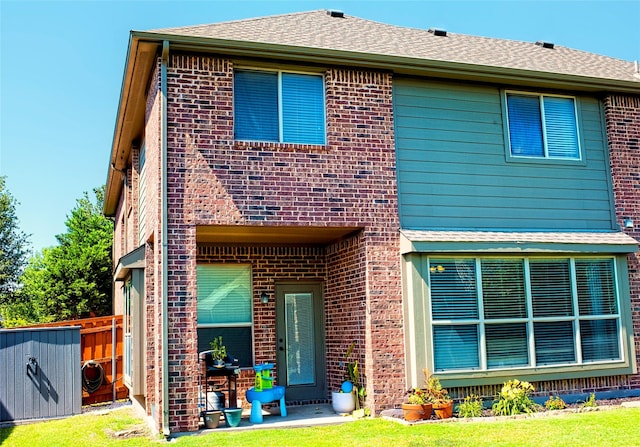 2608 Pine Trail Dr, Little Elm, TX 75068 - back of property with brick siding and roof with shingles