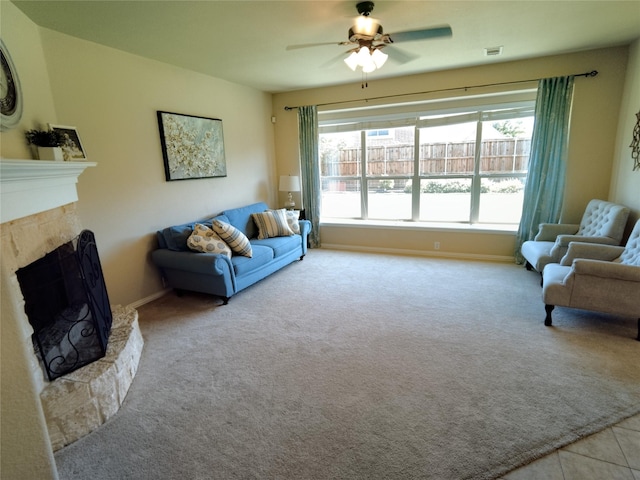 2608 Pine Trail Dr, Little Elm, TX 75068 - living area with ceiling fan, a fireplace with raised hearth, carpet flooring, and baseboards