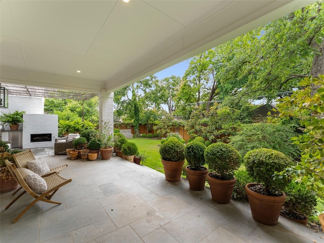6614 Glendora Ave, Dallas, TX 75230 - view of patio / terrace featuring exterior fireplace