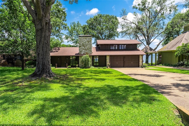 188 Enchanted Dr, Enchanted Oaks, TX 75156 - view of front of property featuring a chimney, concrete driveway, an attached garage, and a front lawn