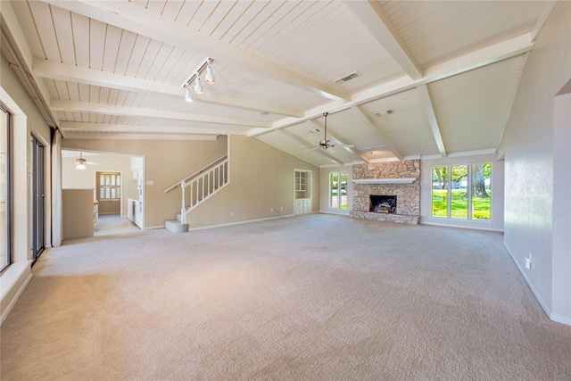 188 Enchanted Dr, Enchanted Oaks, TX 75156 - unfurnished living room featuring ceiling fan, carpet, baseboards, a stone fireplace, and stairway