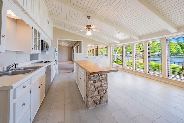 188 Enchanted Dr, Enchanted Oaks, TX 75156 - kitchen with a sink, stainless steel appliances, butcher block counters, and white cabinetry
