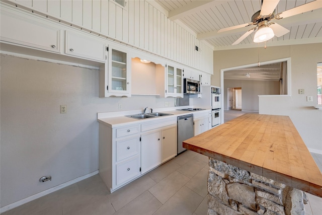 188 Enchanted Dr, Enchanted Oaks, TX 75156 - kitchen featuring appliances with stainless steel finishes, a sink, light countertops, a ceiling fan, and baseboards