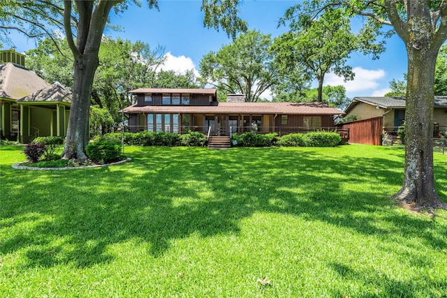 188 Enchanted Dr, Enchanted Oaks, TX 75156 - rear view of property featuring a lawn and a chimney