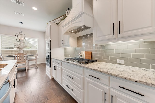 10321 Colina Dr, Fort Worth, TX 76126 - kitchen featuring custom exhaust hood, stainless steel appliances, white cabinets, baseboards, and a chandelier