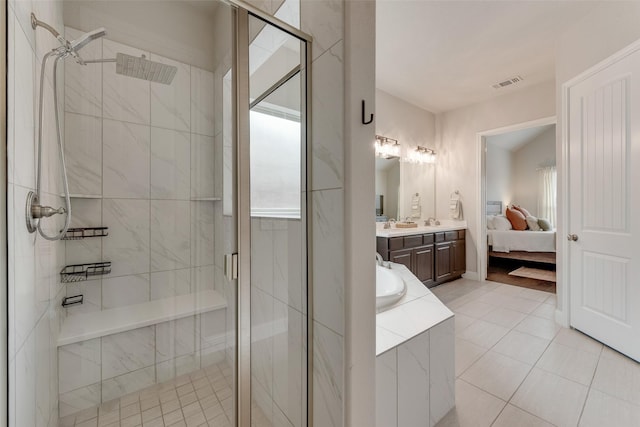 10321 Colina Dr, Fort Worth, TX 76126 - bathroom with double vanity, a stall shower, tile patterned floors, a relaxing tiled tub, and connected bathroom