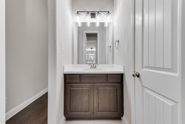10321 Colina Dr, Fort Worth, TX 76126 - bathroom featuring vanity, baseboards, and wood finished floors