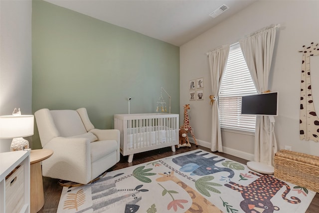 10321 Colina Dr, Fort Worth, TX 76126 - bedroom featuring a crib, dark wood-type flooring, baseboards, and lofted ceiling