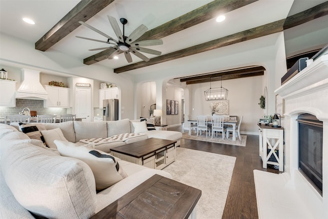 10321 Colina Dr, Fort Worth, TX 76126 - living room featuring arched walkways, beamed ceiling, ceiling fan, dark wood-type flooring, and recessed lighting
