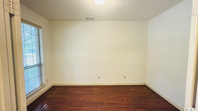 14006 Stevens Point Dr, Frisco, TX 75033 - spare room featuring dark wood-type flooring and baseboards