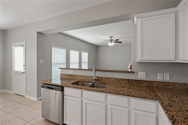 134 Kennedy Dr, Venus, TX 76084 - kitchen with stainless steel dishwasher, a sink, a ceiling fan, and white cabinetry