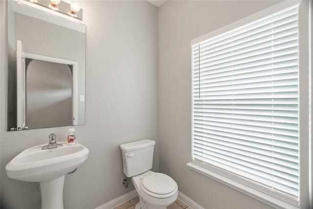 134 Kennedy Dr, Venus, TX 76084 - bathroom featuring toilet, baseboards, and tile patterned floors