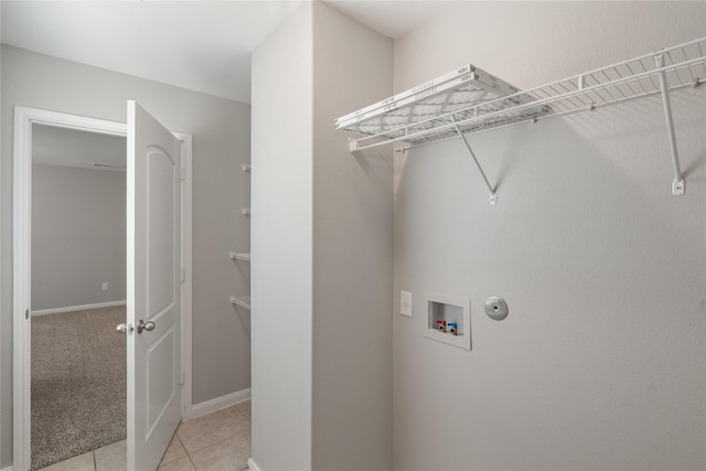 134 Kennedy Dr, Venus, TX 76084 - laundry room featuring washer hookup, light tile patterned floors, and baseboards