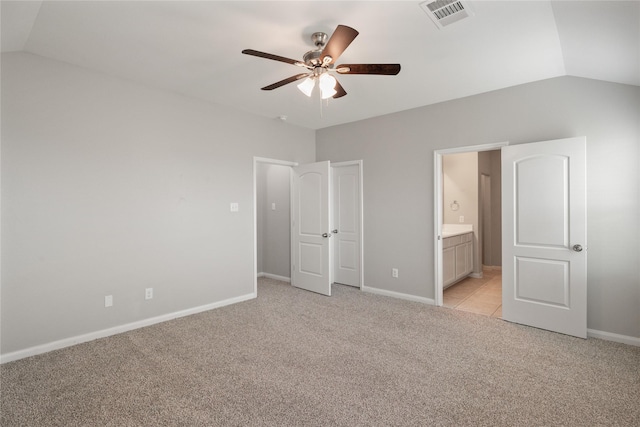 134 Kennedy Dr, Venus, TX 76084 - unfurnished bedroom featuring light colored carpet, lofted ceiling, baseboards, ensuite bathroom, and ceiling fan