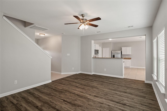 134 Kennedy Dr, Venus, TX 76084 - unfurnished living room with light wood-style flooring, plenty of natural light, and ceiling fan