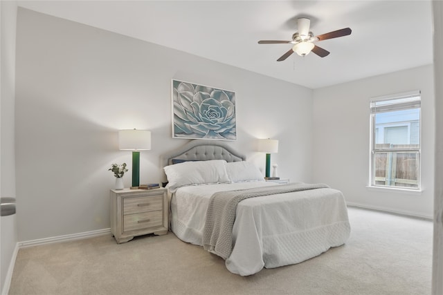 634 N Tyler St, Dallas, TX 75208 - bedroom featuring light colored carpet, baseboards, and ceiling fan