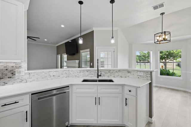 130 N Point Dr, Krum, TX 76249 - kitchen featuring stainless steel dishwasher, a sink, backsplash, white cabinets, and light countertops