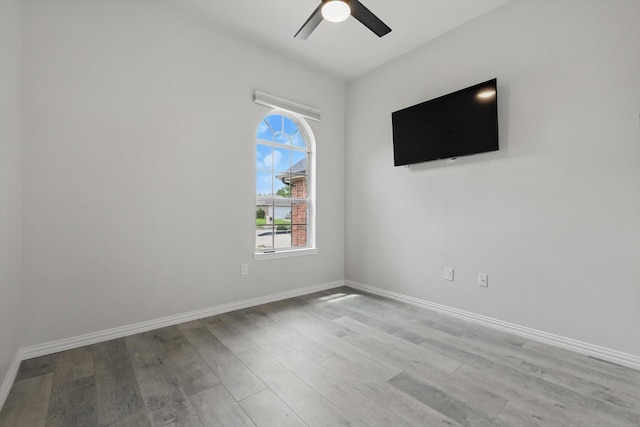 130 N Point Dr, Krum, TX 76249 - empty room featuring wood finished floors, a ceiling fan, and baseboards