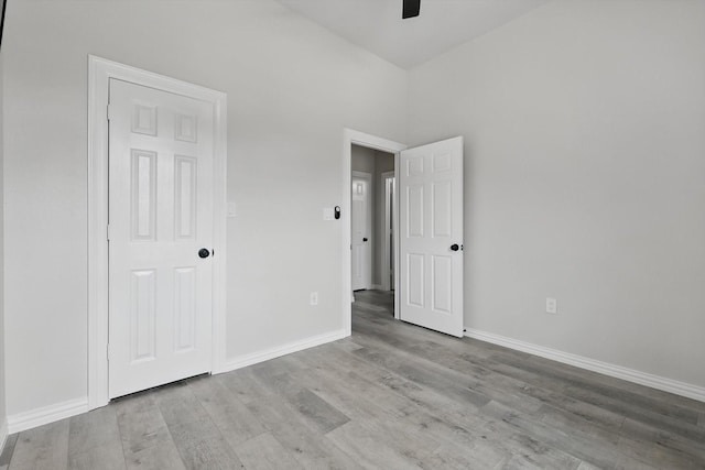 130 N Point Dr, Krum, TX 76249 - unfurnished bedroom featuring wood finished floors, baseboards, and a ceiling fan