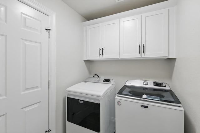 130 N Point Dr, Krum, TX 76249 - laundry area featuring cabinet space and independent washer and dryer