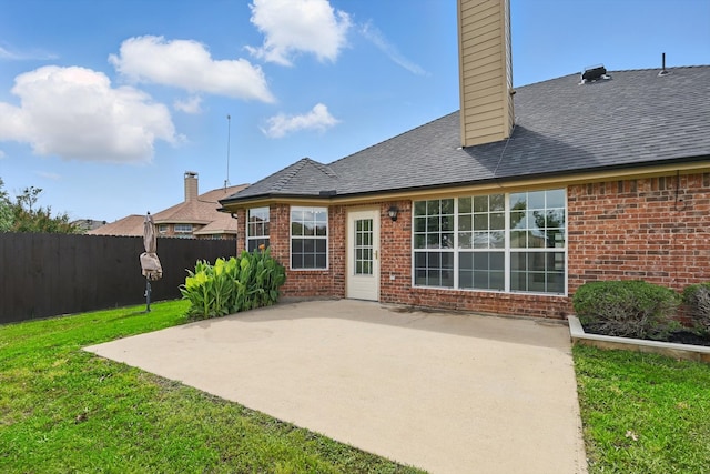 130 N Point Dr, Krum, TX 76249 - rear view of property featuring brick siding, a patio, a chimney, and roof with shingles